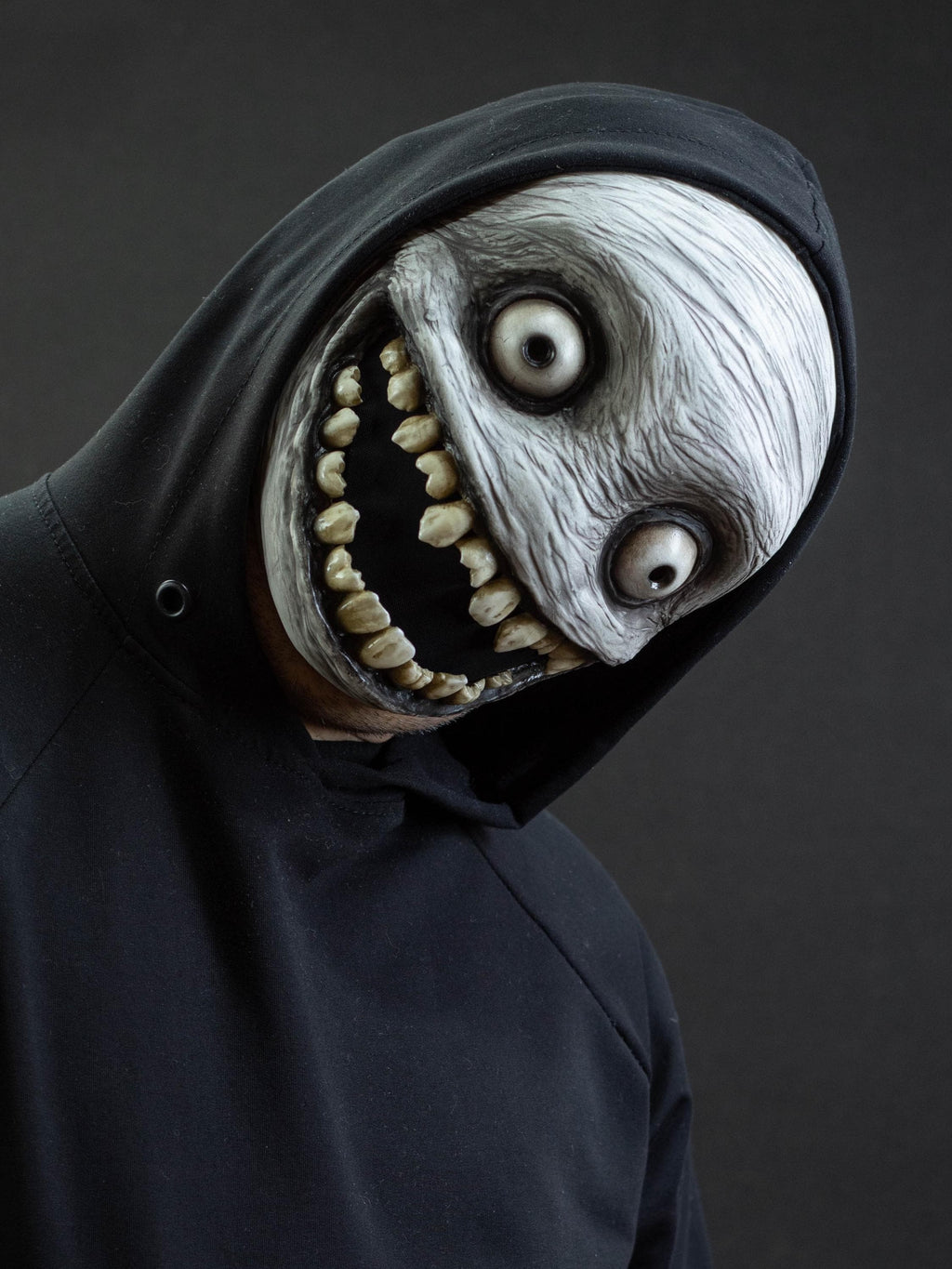 Crazy smile mask with bulging eyes for Halloween or a funny gift
