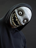 Crazy smile mask with bulging eyes for Halloween or a funny gift