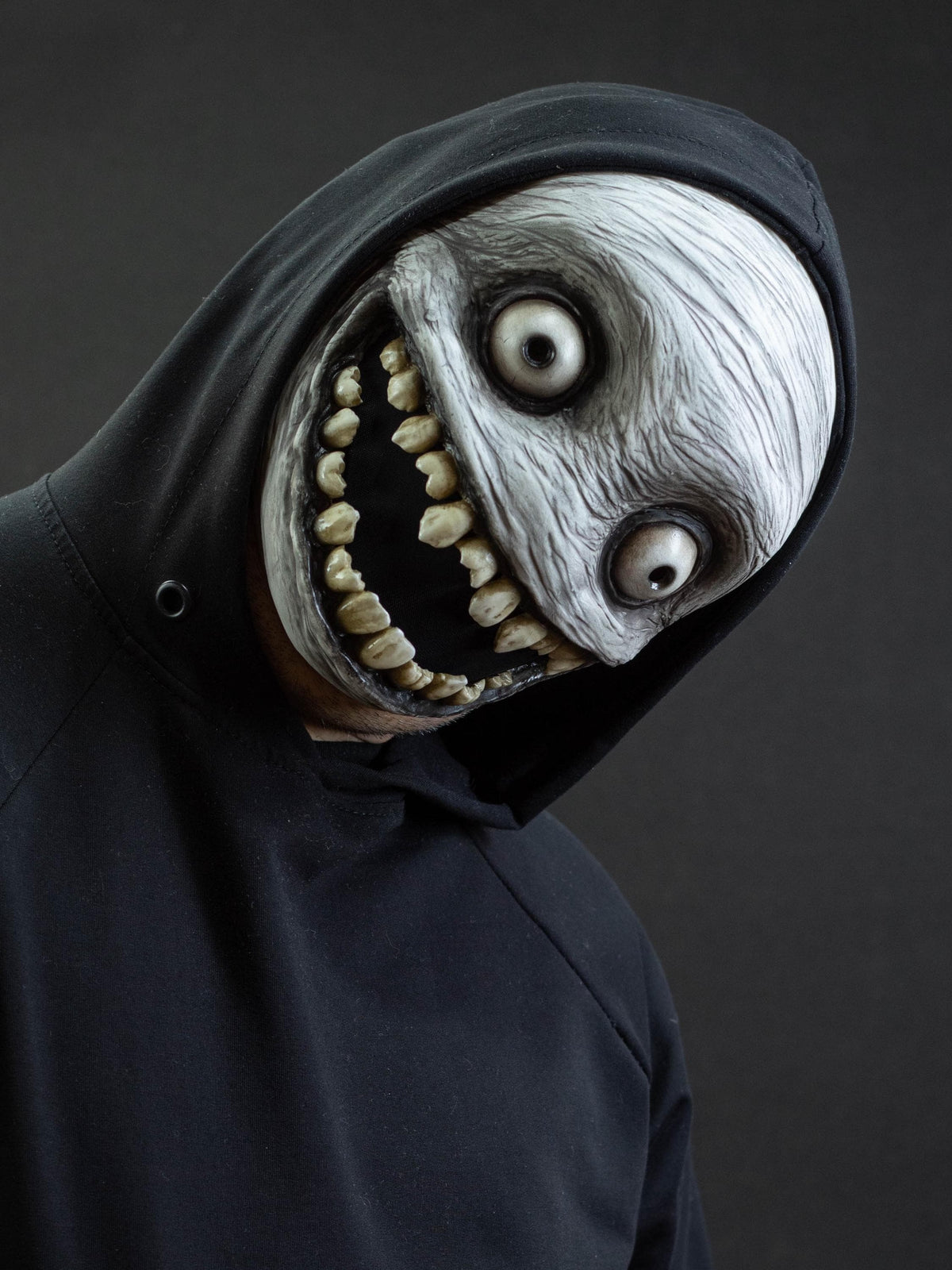 Crazy smile mask with bulging eyes for Halloween or a funny gift