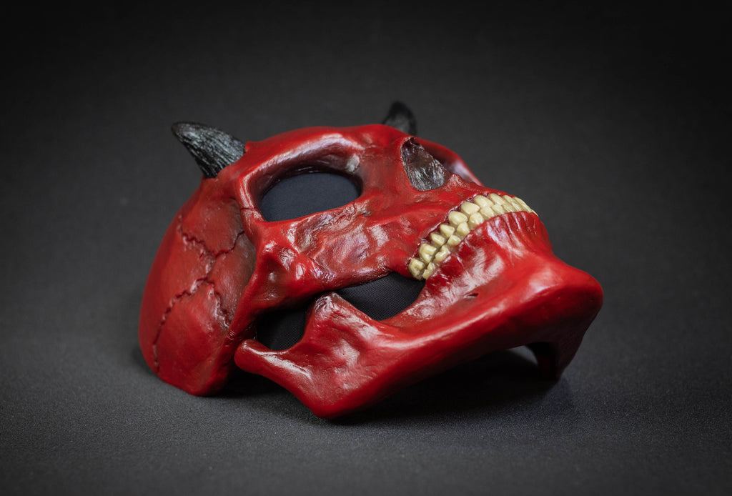 Human Skull mask with small black horns and red shape