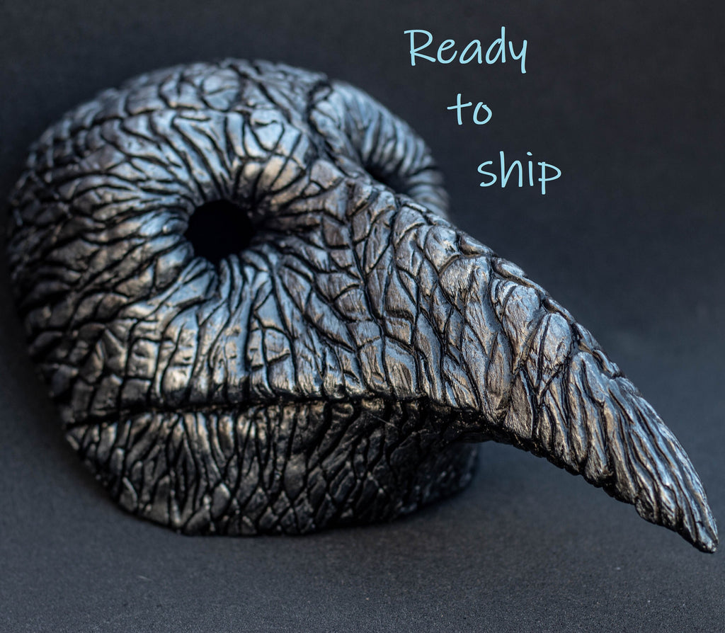 Plague Doctor mask for Helloween party and carnival or masquerade. Bird mask metallic shape.