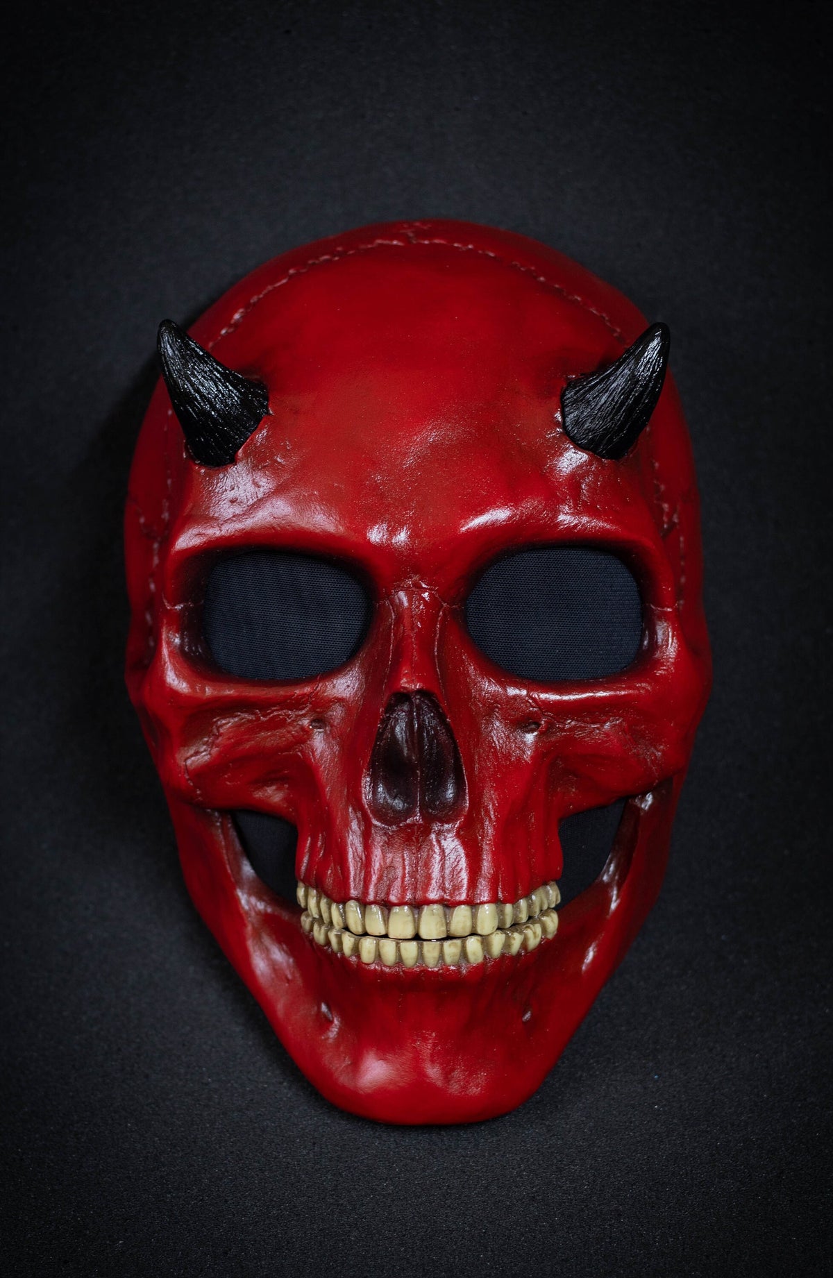 Human Skull mask with small black horns and red shape