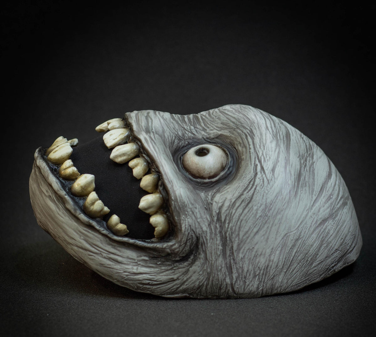 Crazy smile mask with bulging eyes for Halloween or a funny gift
