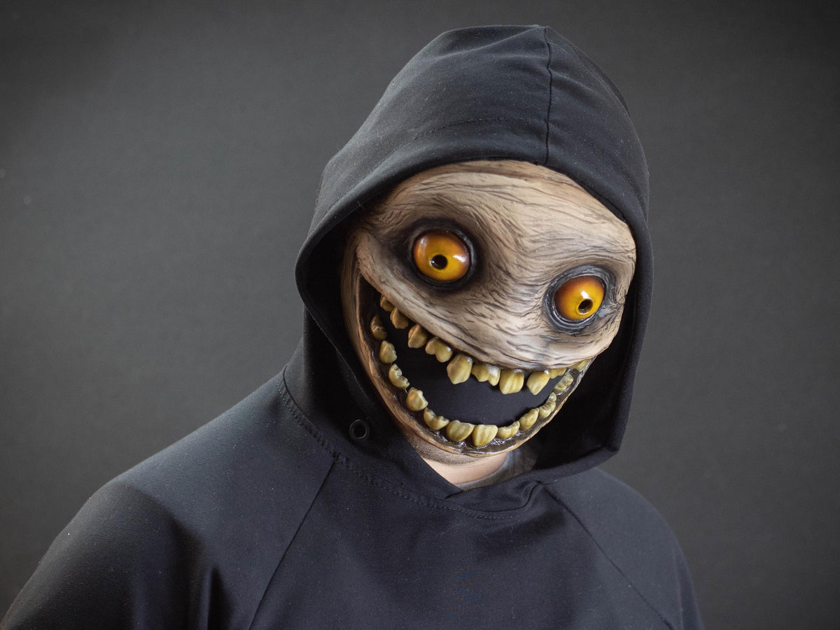 Crazy smile mask with yellow eyes for Halloween or a funny gift