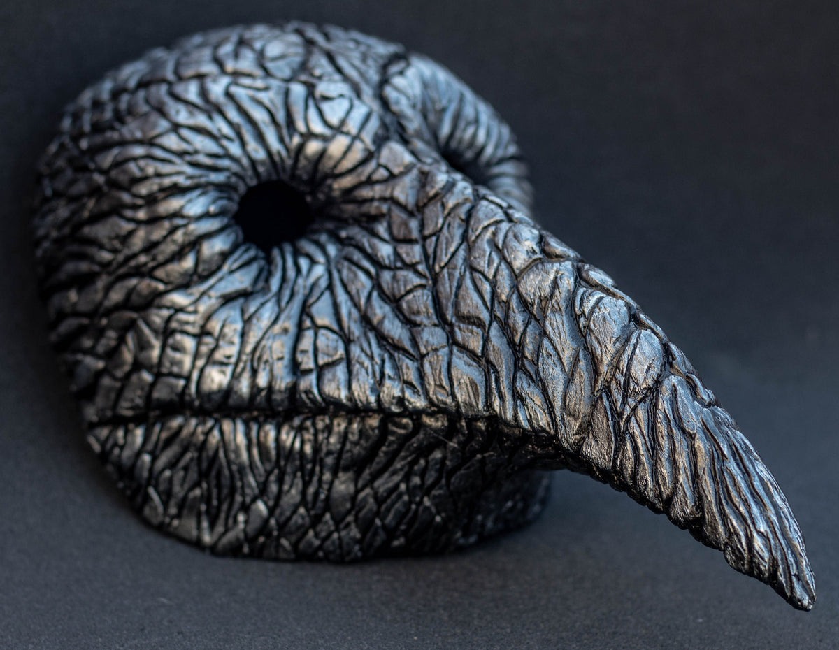 Plague Doctor mask for Helloween party and carnival or masquerade. Bird mask metallic shape.