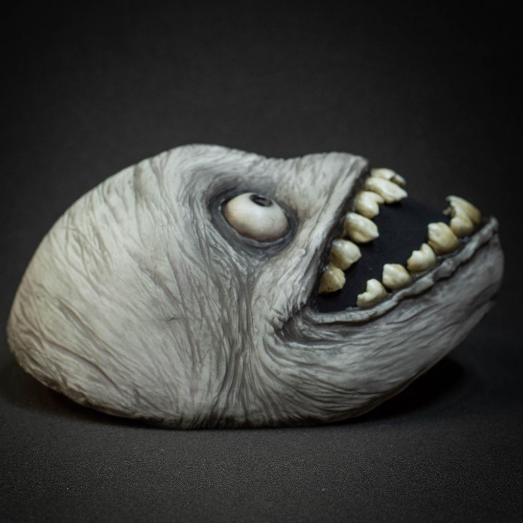 Crazy smile mask with bulging eyes for Halloween or a funny gift