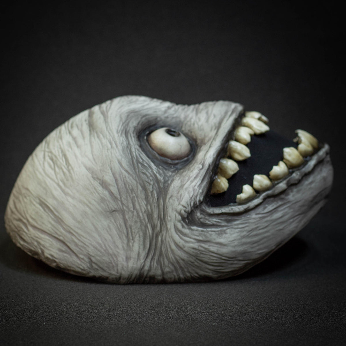 Crazy smile mask with bulging eyes for Halloween or a funny gift