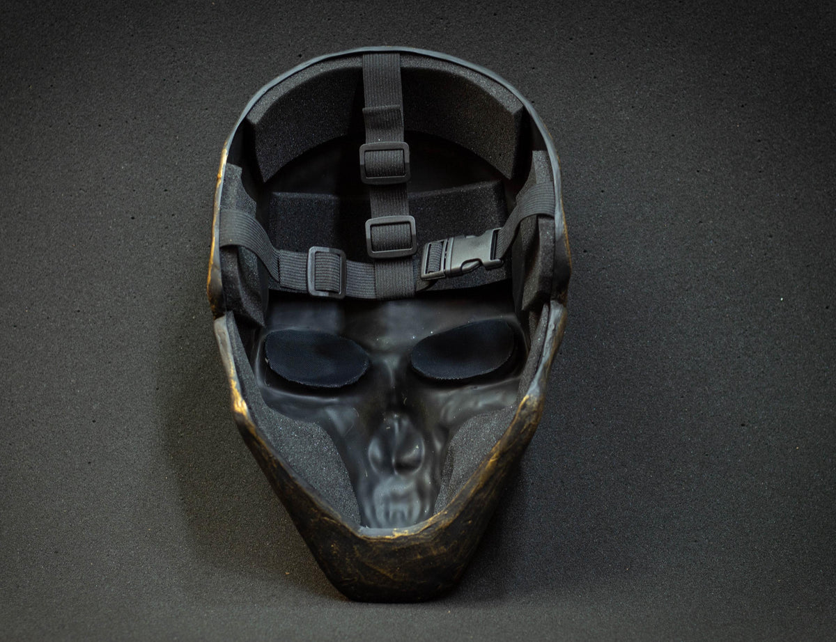 Black skull mask with gold scuffs for cosplay or gift