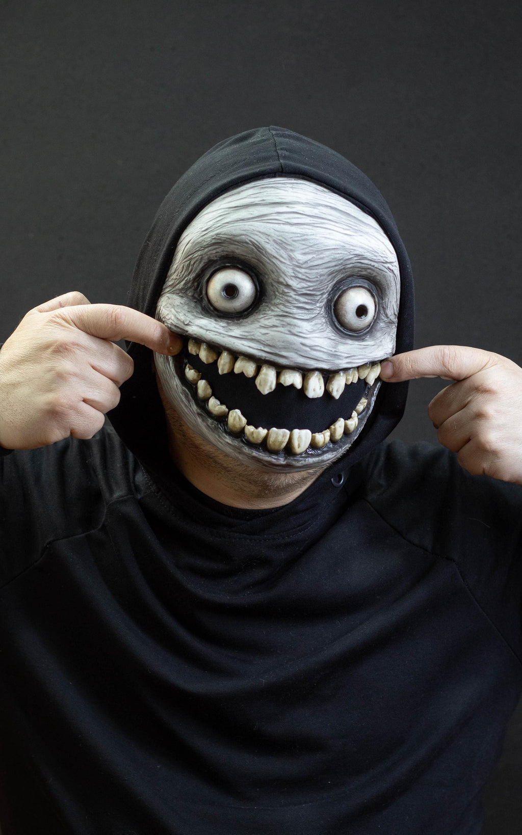 Crazy smile mask with bulging eyes for Halloween or a funny gift