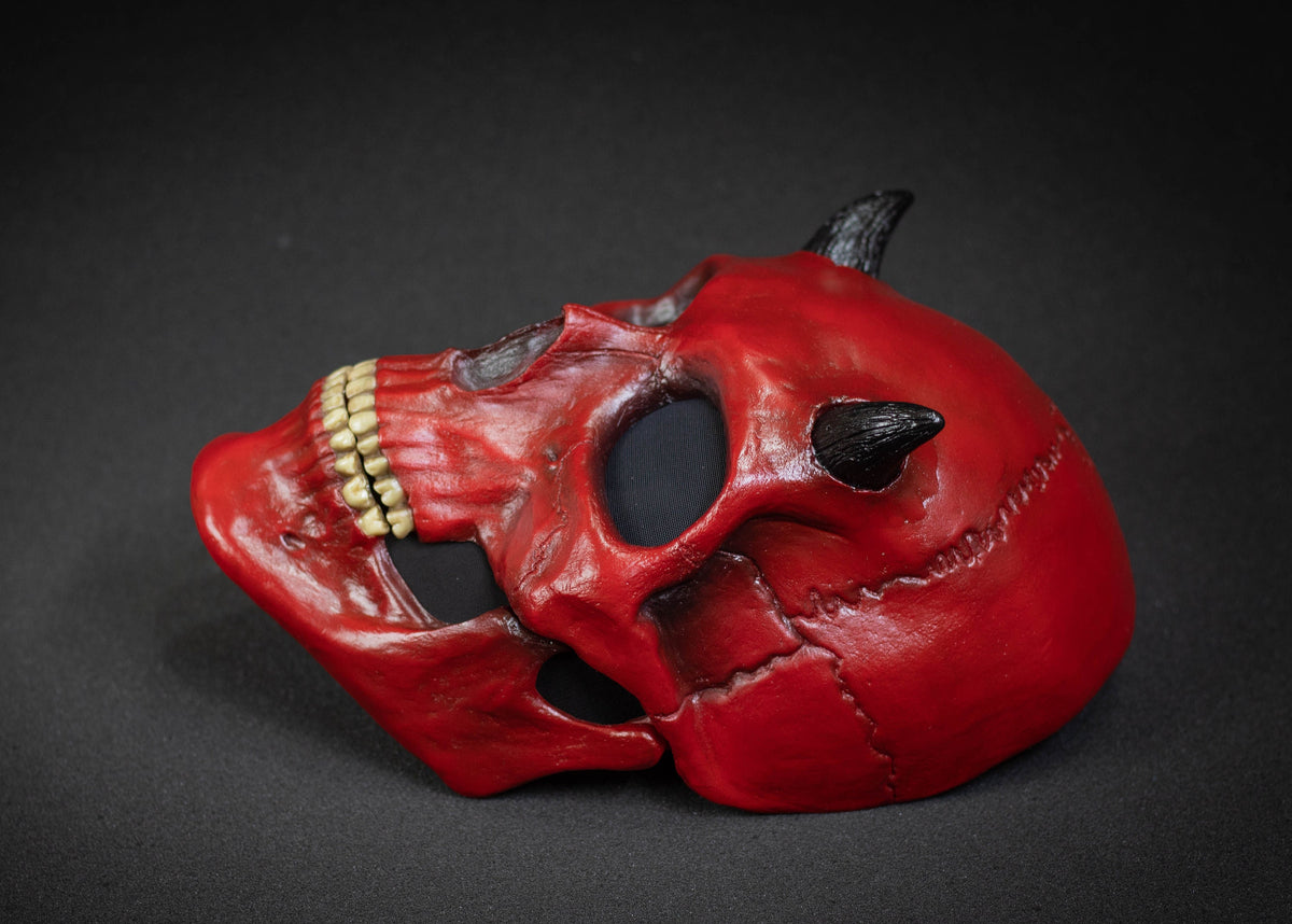 Human Skull mask with small black horns and red shape
