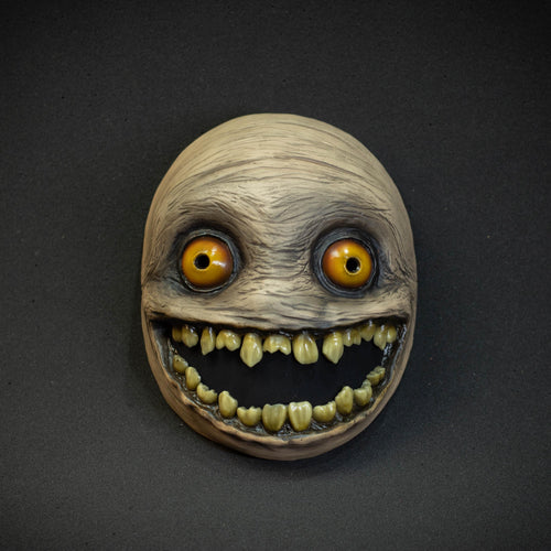 Crazy smile mask with yellow eyes for Halloween or a funny gift