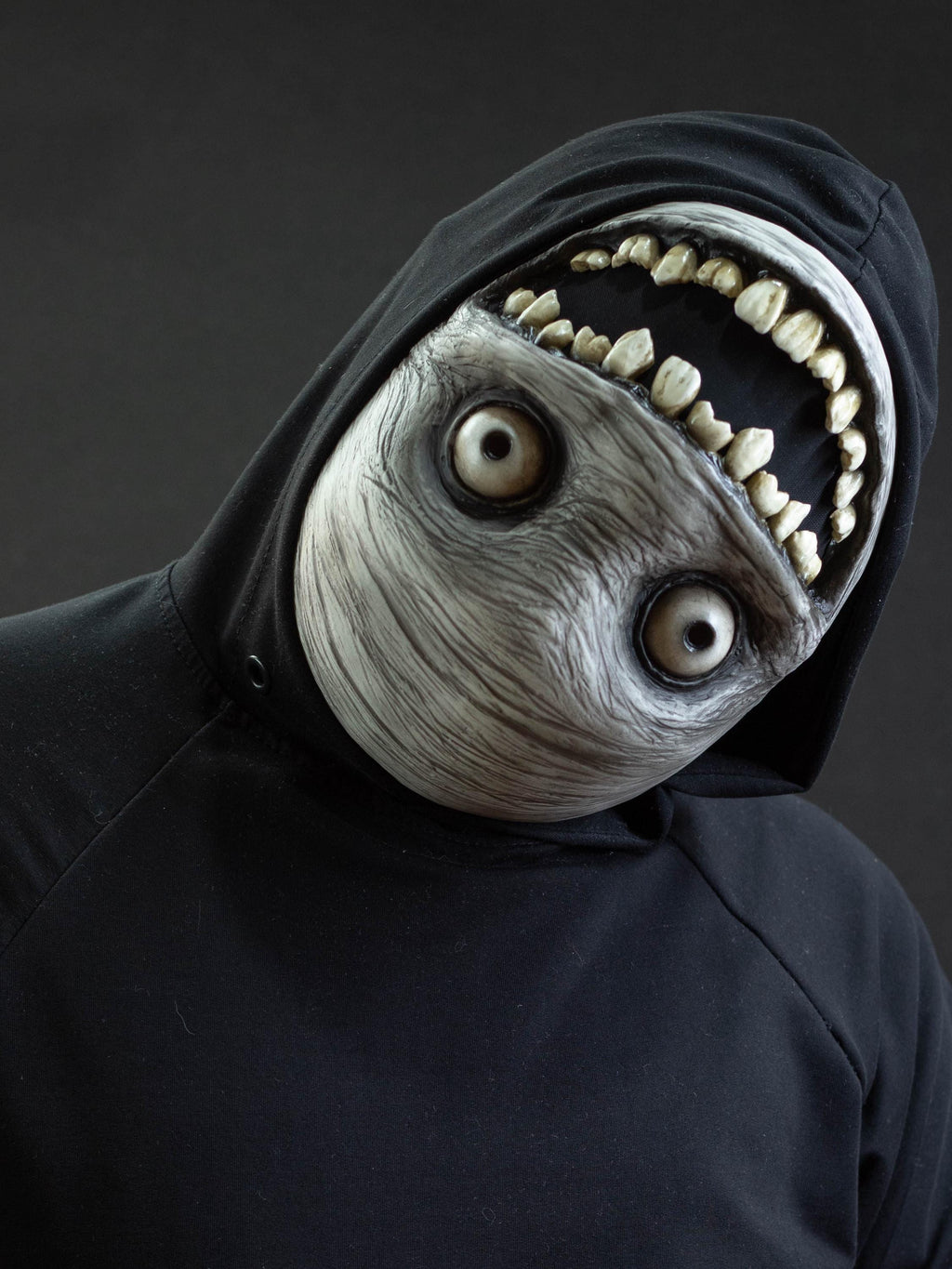 Crazy smile mask with bulging eyes for Halloween or a funny gift
