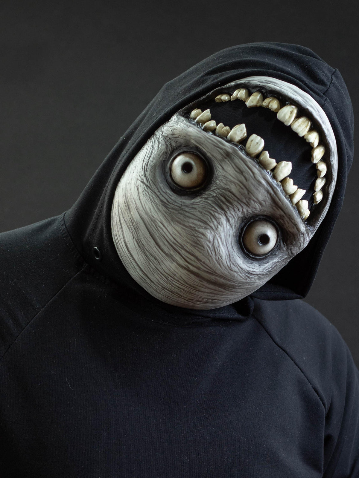 Crazy smile mask with bulging eyes for Halloween or a funny gift