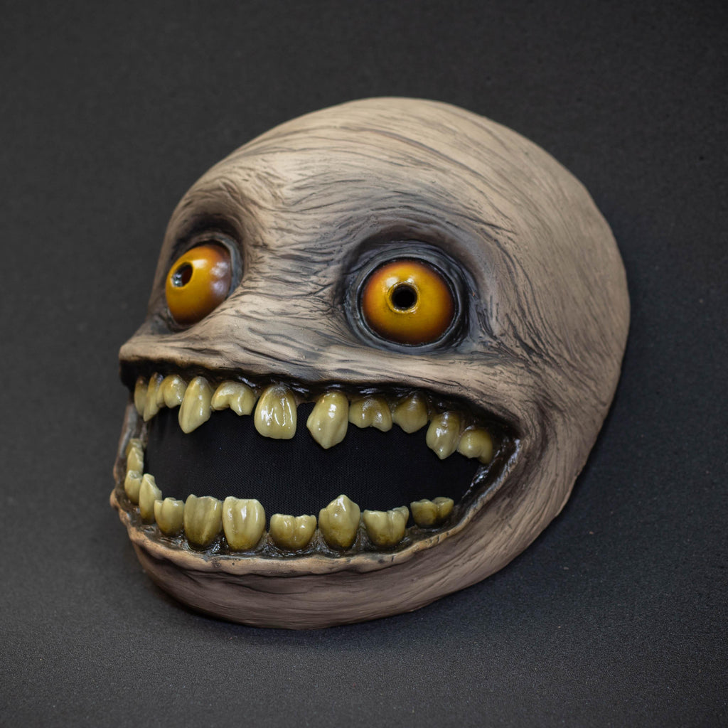 Crazy smile mask with yellow eyes for Halloween or a funny gift