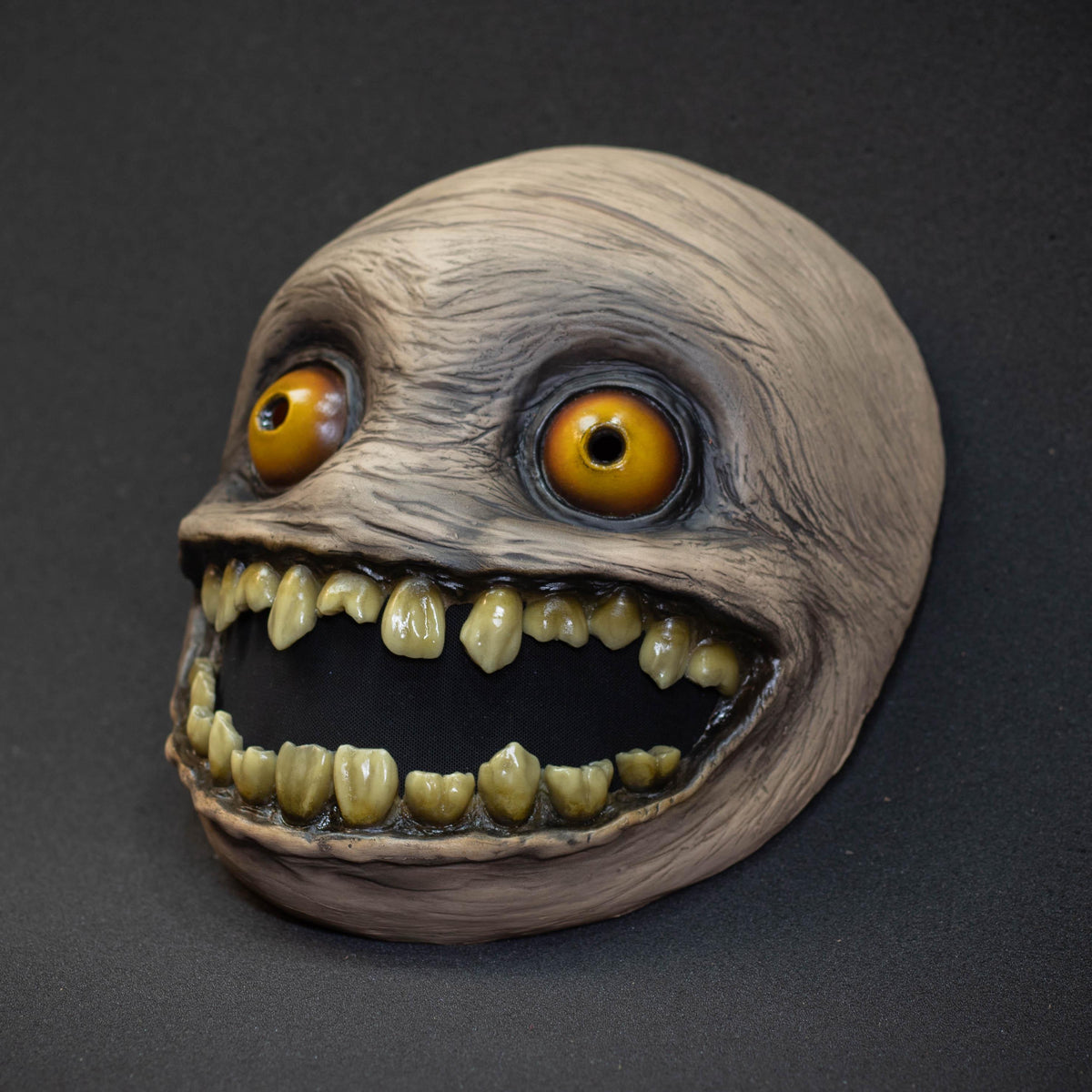Crazy smile mask with yellow eyes for Halloween or a funny gift