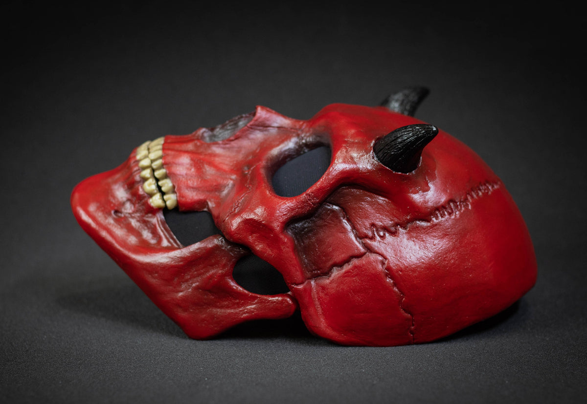 Human Skull mask with small black horns and red shape