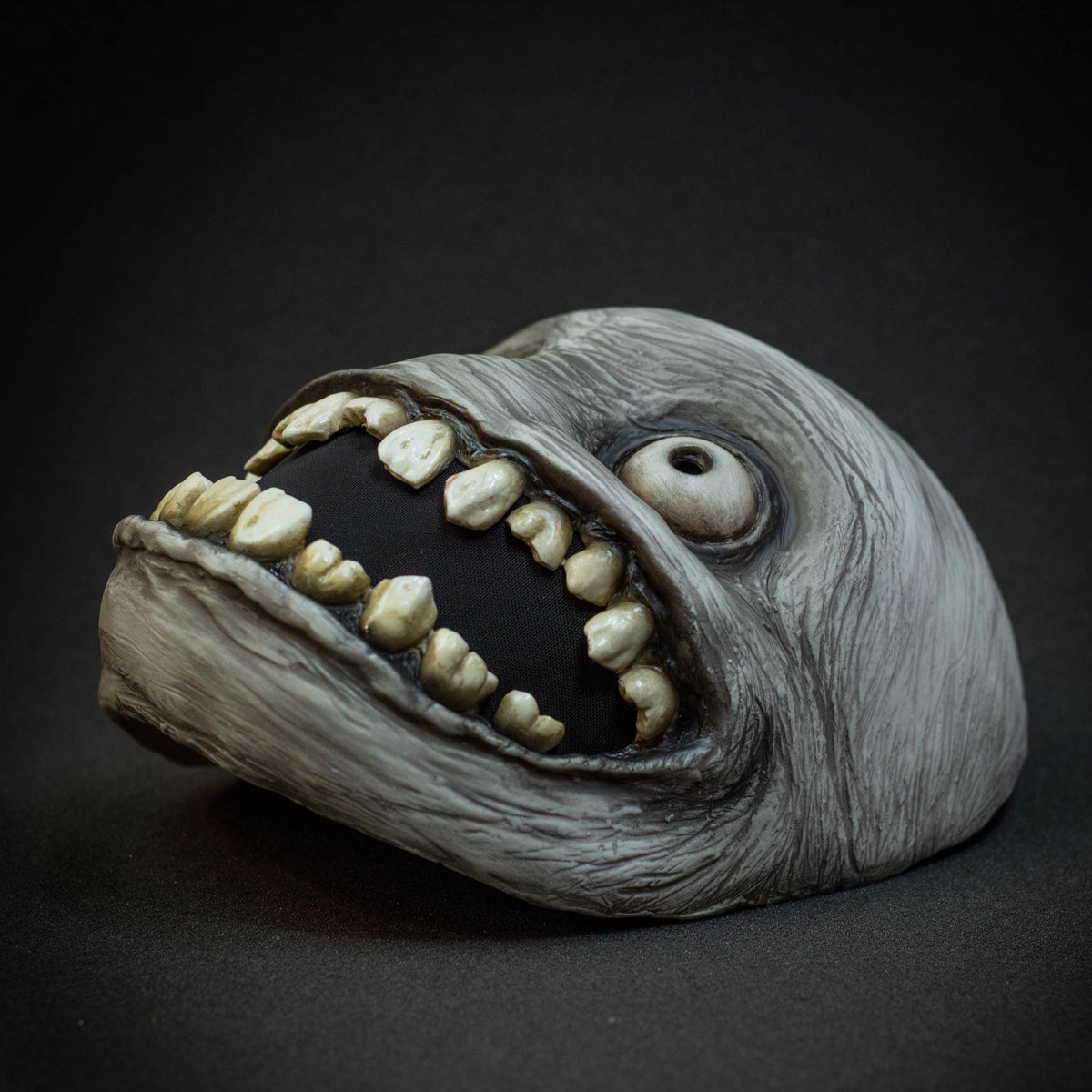 Crazy smile mask with bulging eyes for Halloween or a funny gift