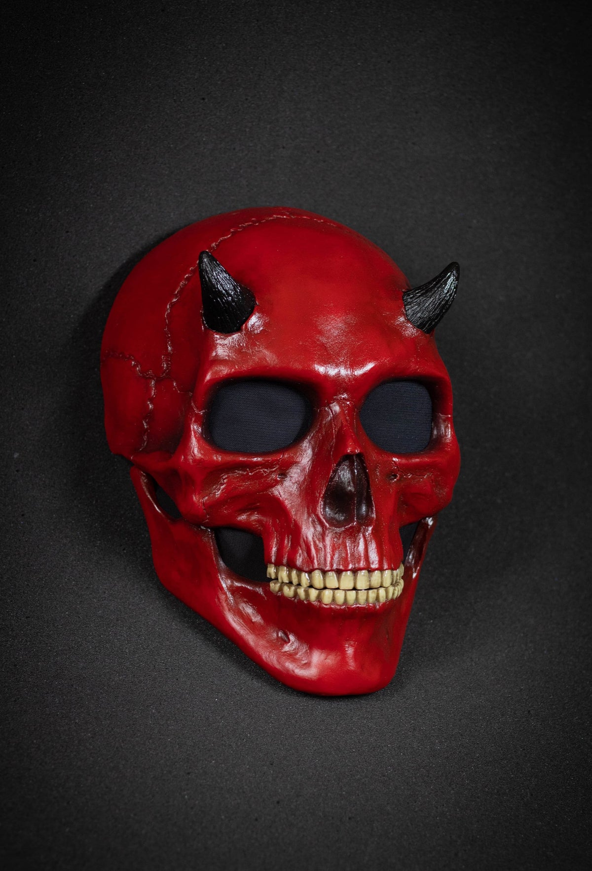 Human Skull mask with small black horns and red shape