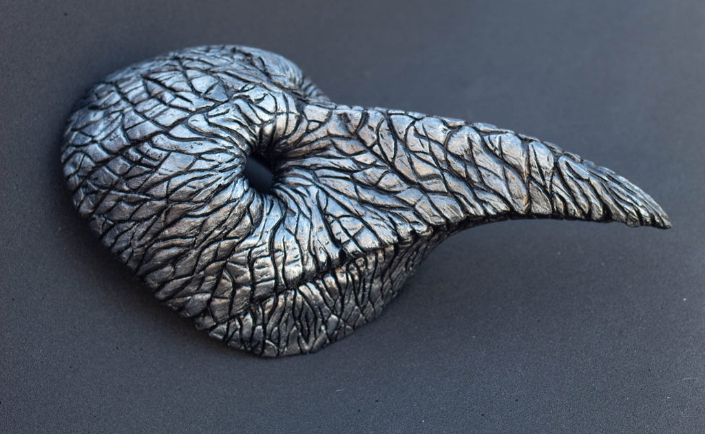 Plague Doctor mask for Helloween party and carnival or masquerade. Bird mask metallic shape.
